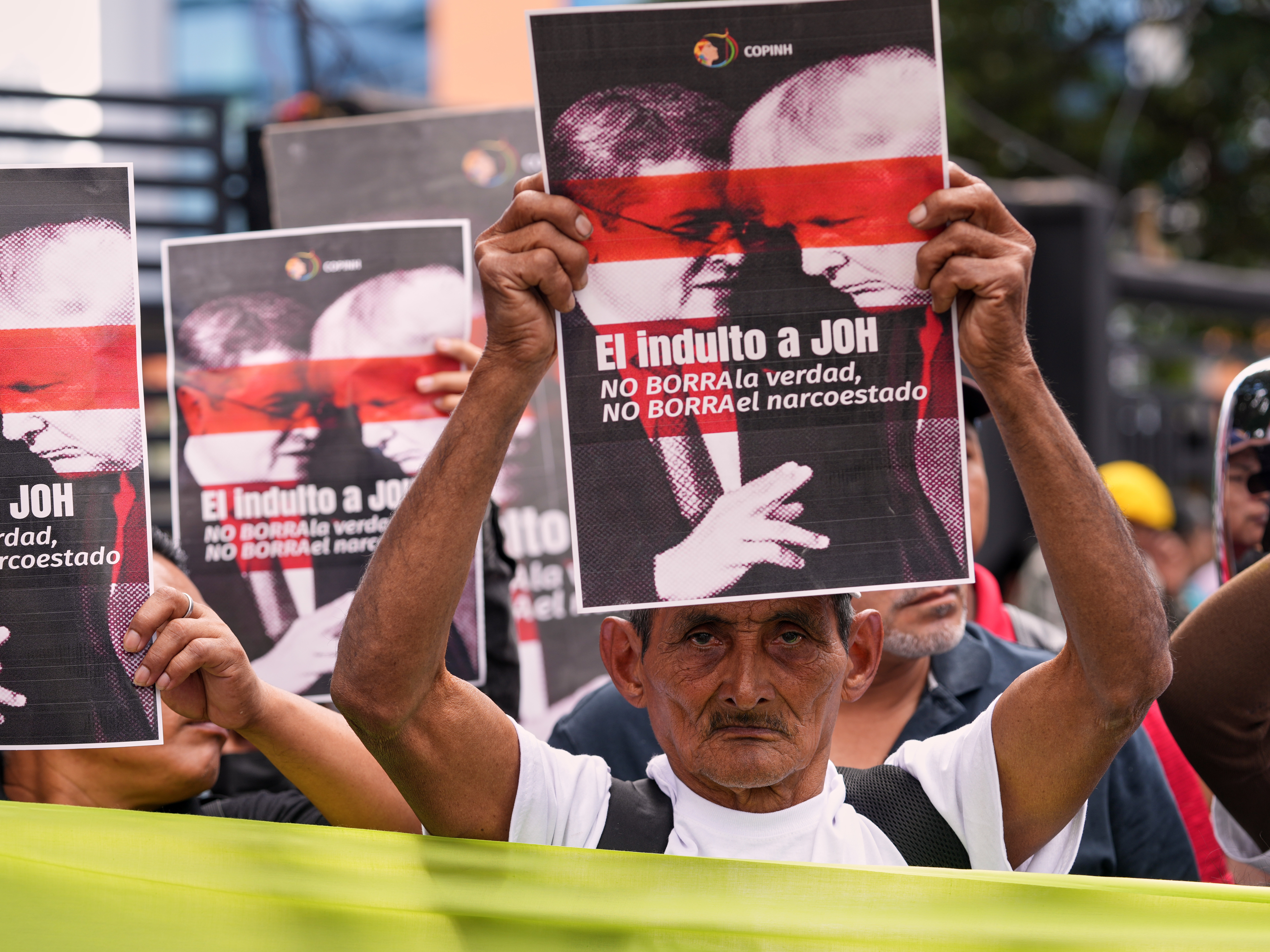 caption: Farmers protest against President Donald Trump's pardon of Honduras' former President Juan Orlando Hernandez in Tegucigalpa, Honduras, Thursday, Dec. 4, 2025.
