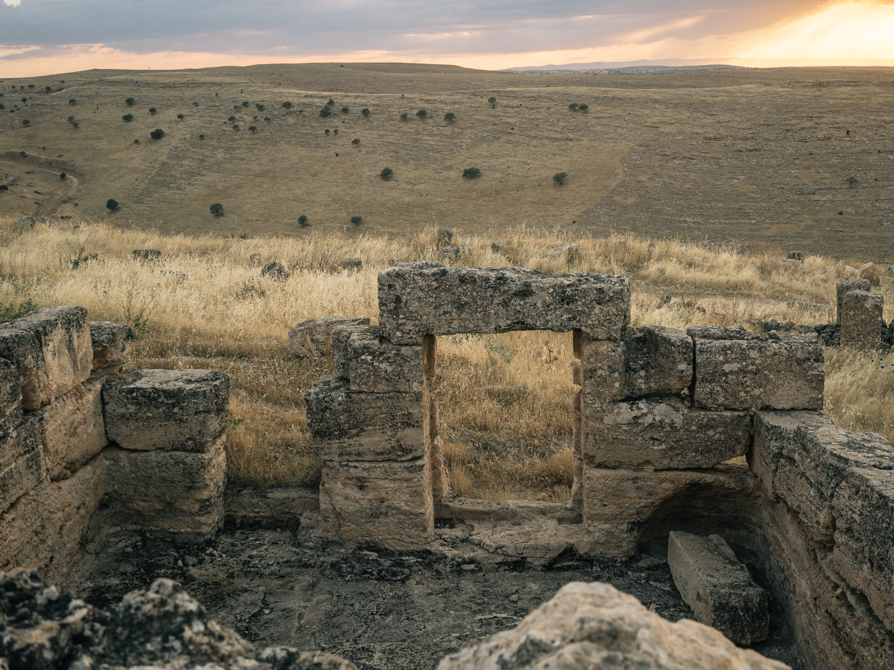 caption: Ruins of housing believed to have been used by soldiers stationed at the garrison.