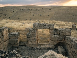 caption: Ruins of housing believed to have been used by soldiers stationed at the garrison.