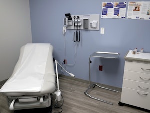 caption: An exam room is seen inside Planned Parenthood in March 2023. Republican attorneys general from 17 states filed a lawsuit on Thursday, challenging new federal rules entitling workers to time off and other accommodations for abortions, calling the rules an illegal interpretation of a 2022 federal law.