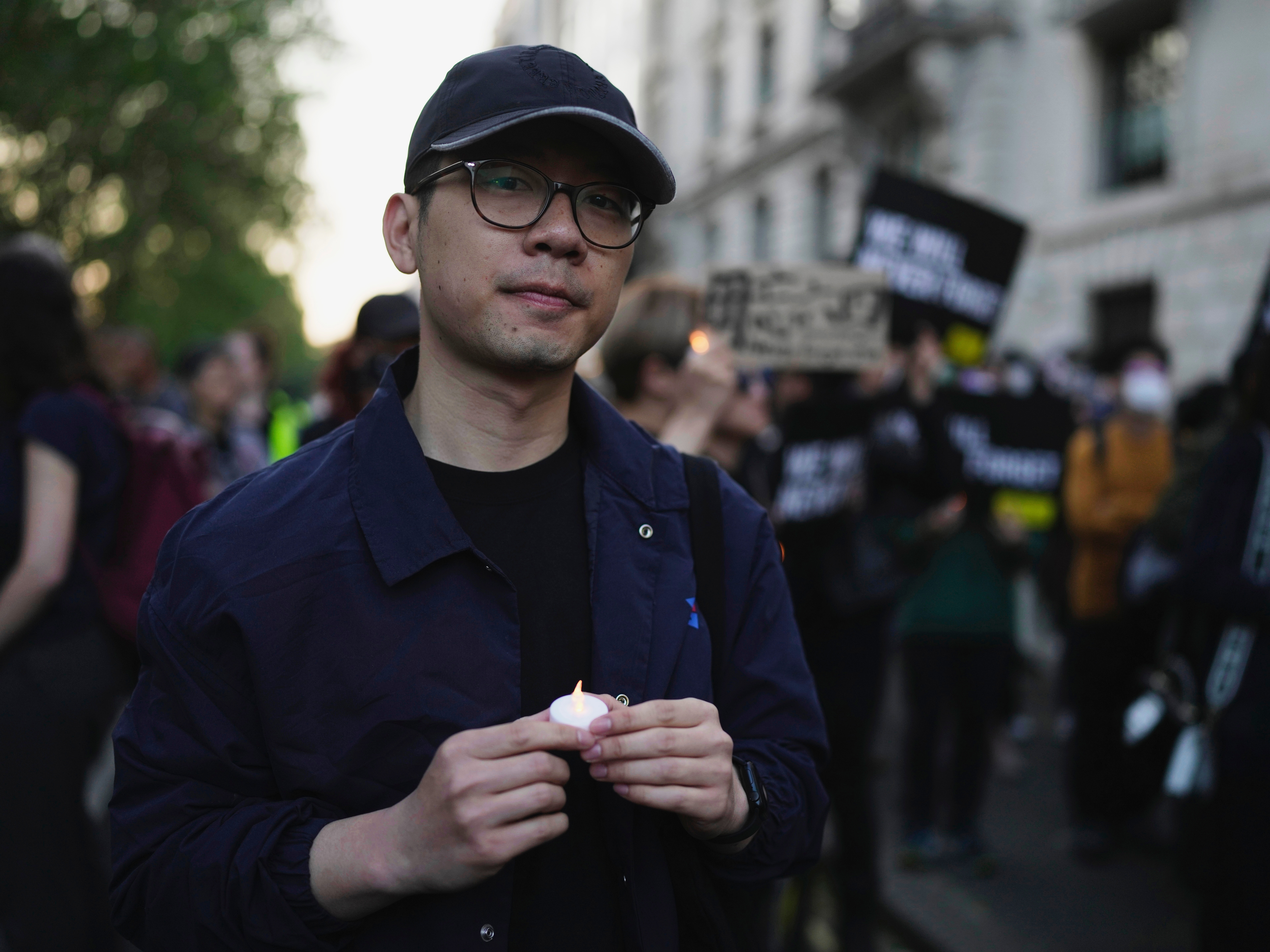 caption: FILE - Hong Kong activist Nathan Law attends a candlelight vigil outside the Chinese Embassy in London on June 4, 2023, to mark the anniversary of China's bloody 1989 crackdown on pro-democracy protests in Beijing's Tiananmen Square.