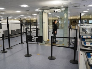 caption: Passengers at the Harry Reid International Airport in Las Vegas will be the first to use the new system, which has been compared to the self-checkout at a grocery store.