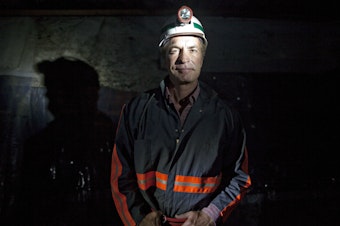 caption: Chris Cline poses for a portrait in a coal mine in Carlinville, Ill., in 2010. The coal magnate was on a helicopter that crashed in the waters off Grand Cay, Bahamas, on Thursday, killing all seven people onboard.