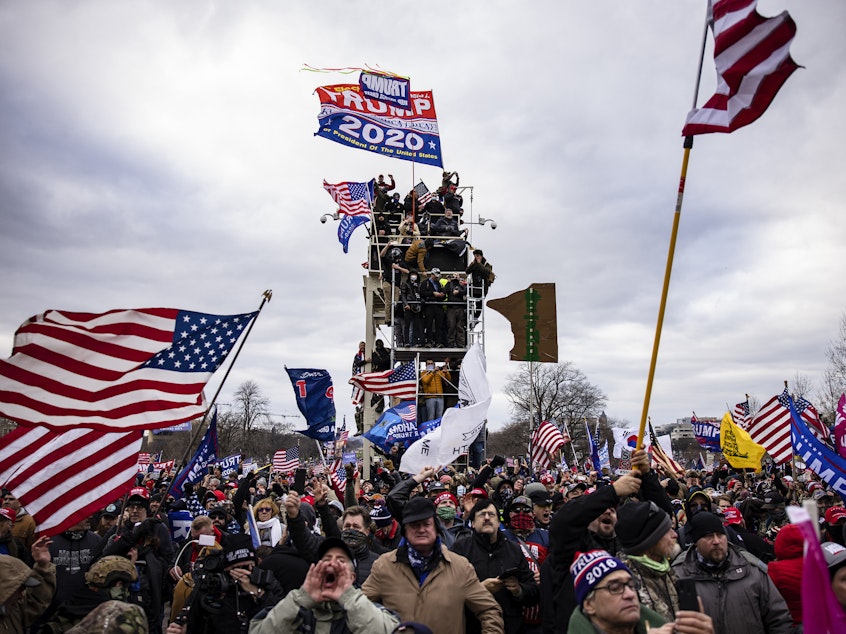 caption: Pro-Trump supporters storm the U.S. Capitol following a rally on Jan. 6. So far, military veterans account for about 15% of those criminally charged in the Capitol riot, according to an NPR analysis.