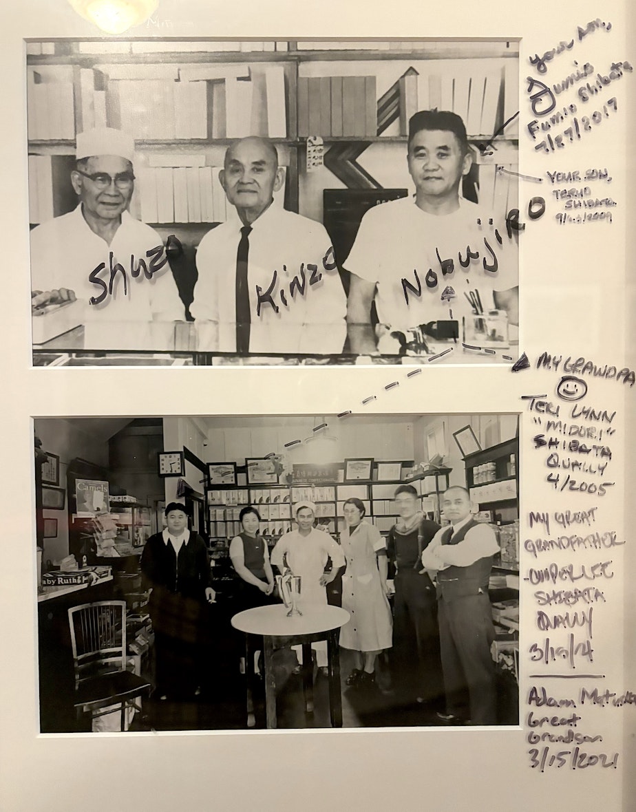 caption: The Panama Hotel in Seattle's Chinatown-International District houses framed photographs of Japanese Americans who once lived in the area. Family members have written some of their names on the glass.