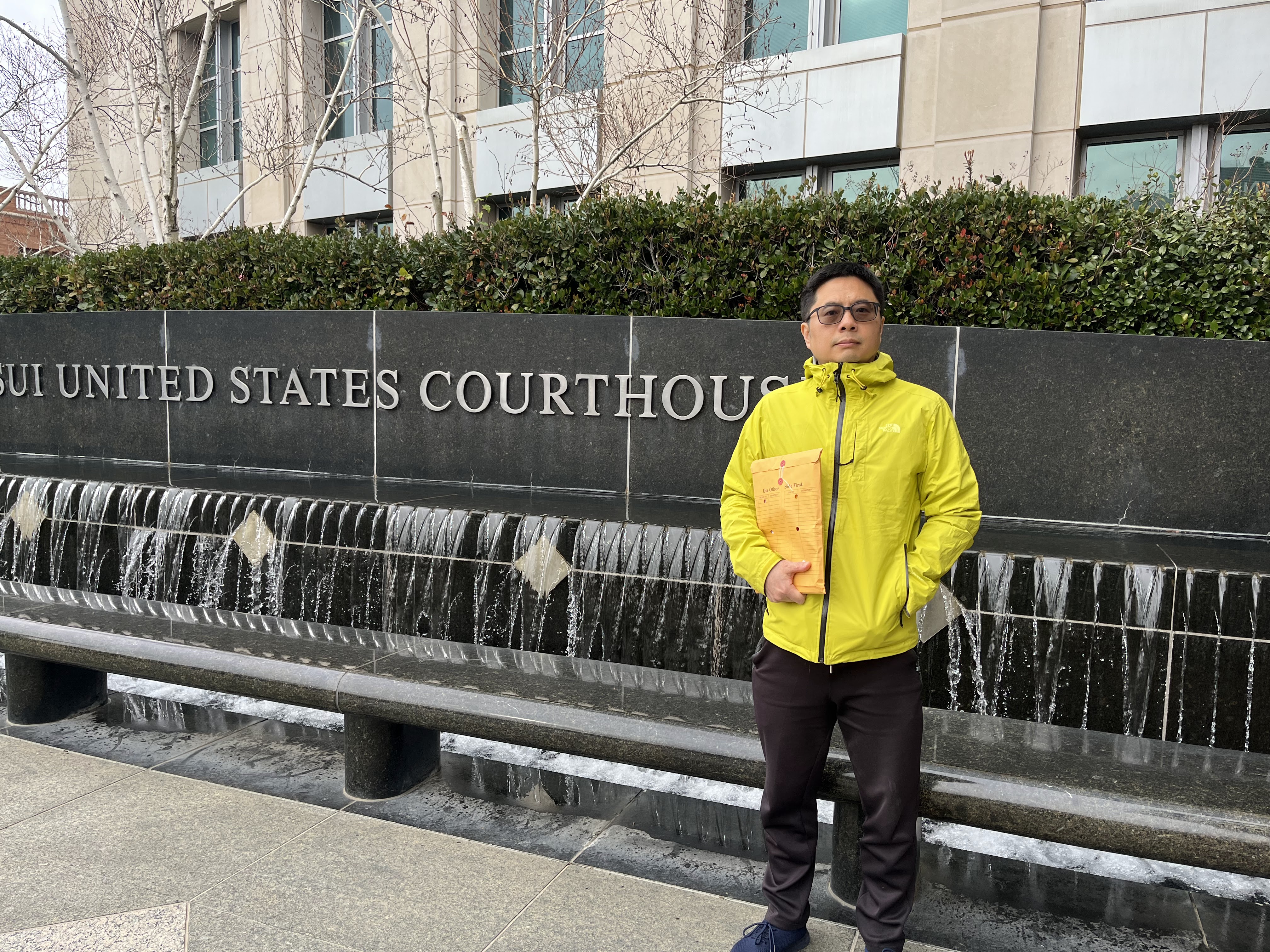 caption: Nan Zhong is using AI tools to help him represent himself and his son in court.