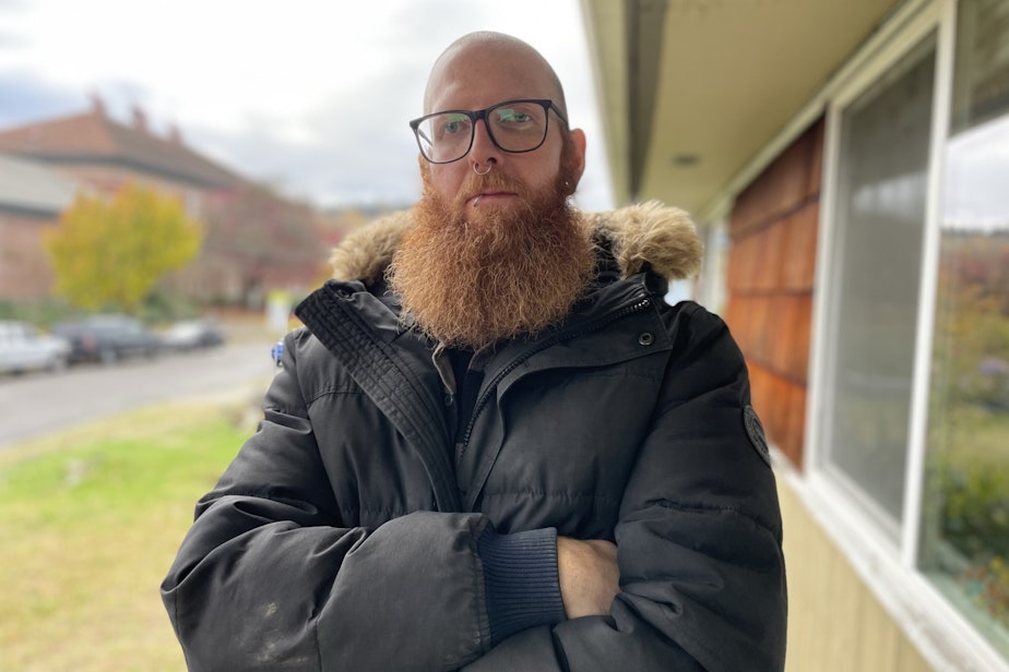caption: Tech worker Eric Andren has lived in South Park since summer 2022. He and his girlfriend were economically displaced from Seattle's Wallingford neighborhood.