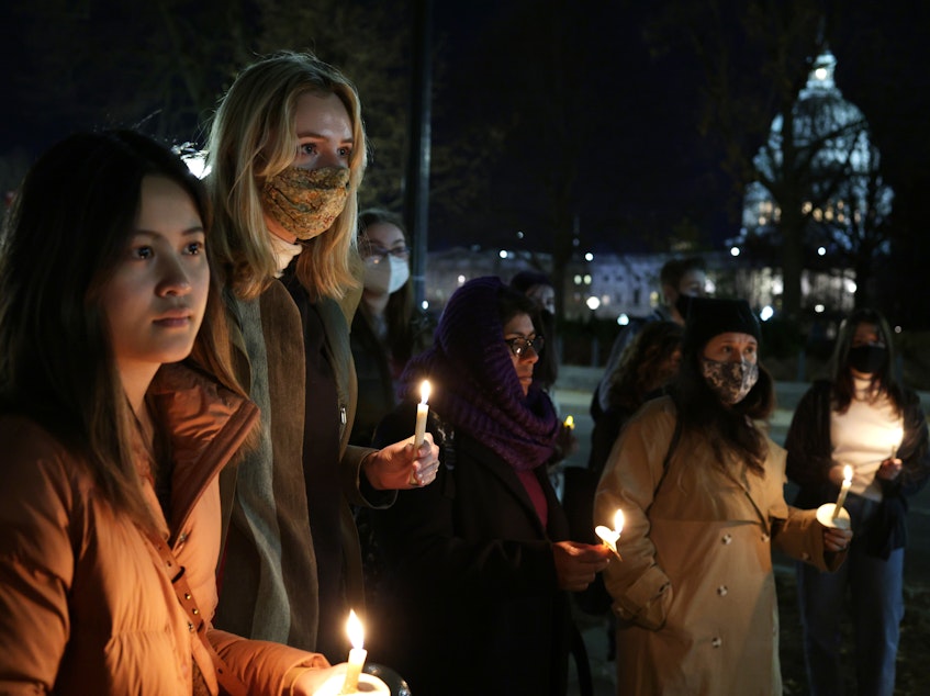 caption: Activists participate in a candlelight vigil for abortion rights near the U.S. Supreme Court on Dec, 13, 2021 in Washington, D.C.