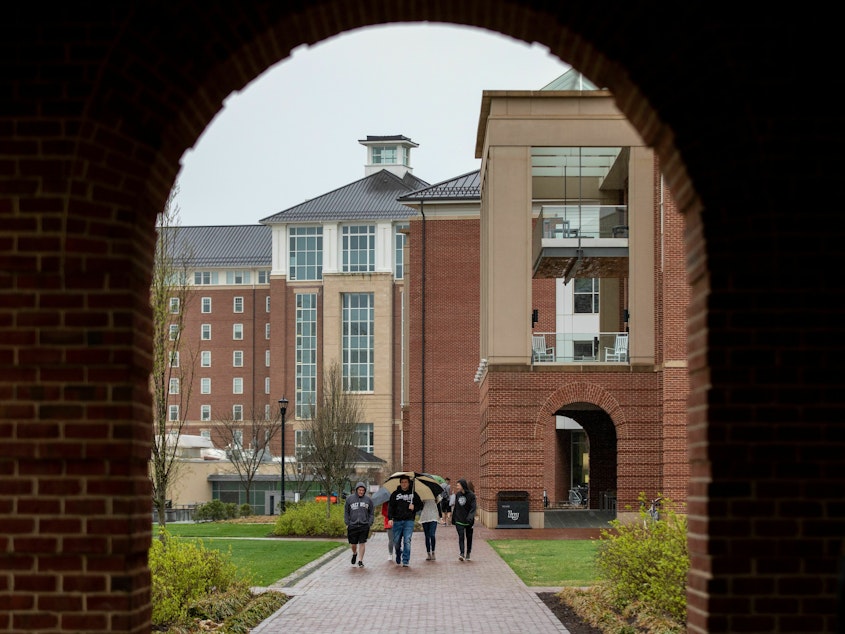 caption: Students walk across Liberty University's campus in Lynchburg, Va.