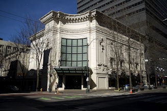 caption: The historic Coliseum Theater,  known to most as Banana Republic's former downtown Seattle location, was put up for auction in May 2024. The results of that auction are not yet publicly known.