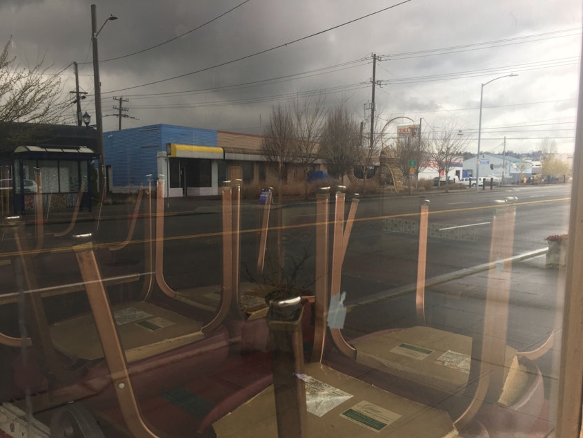 caption: Peeking inside the window of a closed restaurant in South Park.