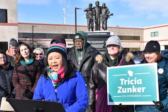 caption: Ka Lo, a member of the Marathon County Board in Wausau, Wis., spoke about the Trump administration's immigration policies at a Feb. 13 rally in the city.
