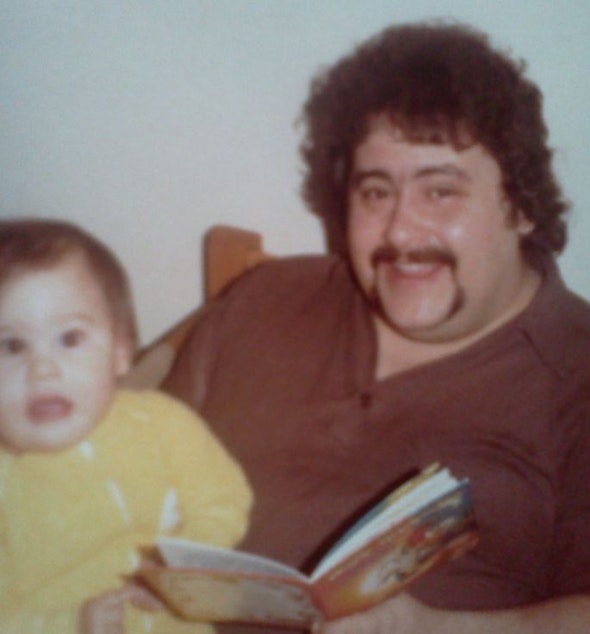 caption: The author as a baby with her father.