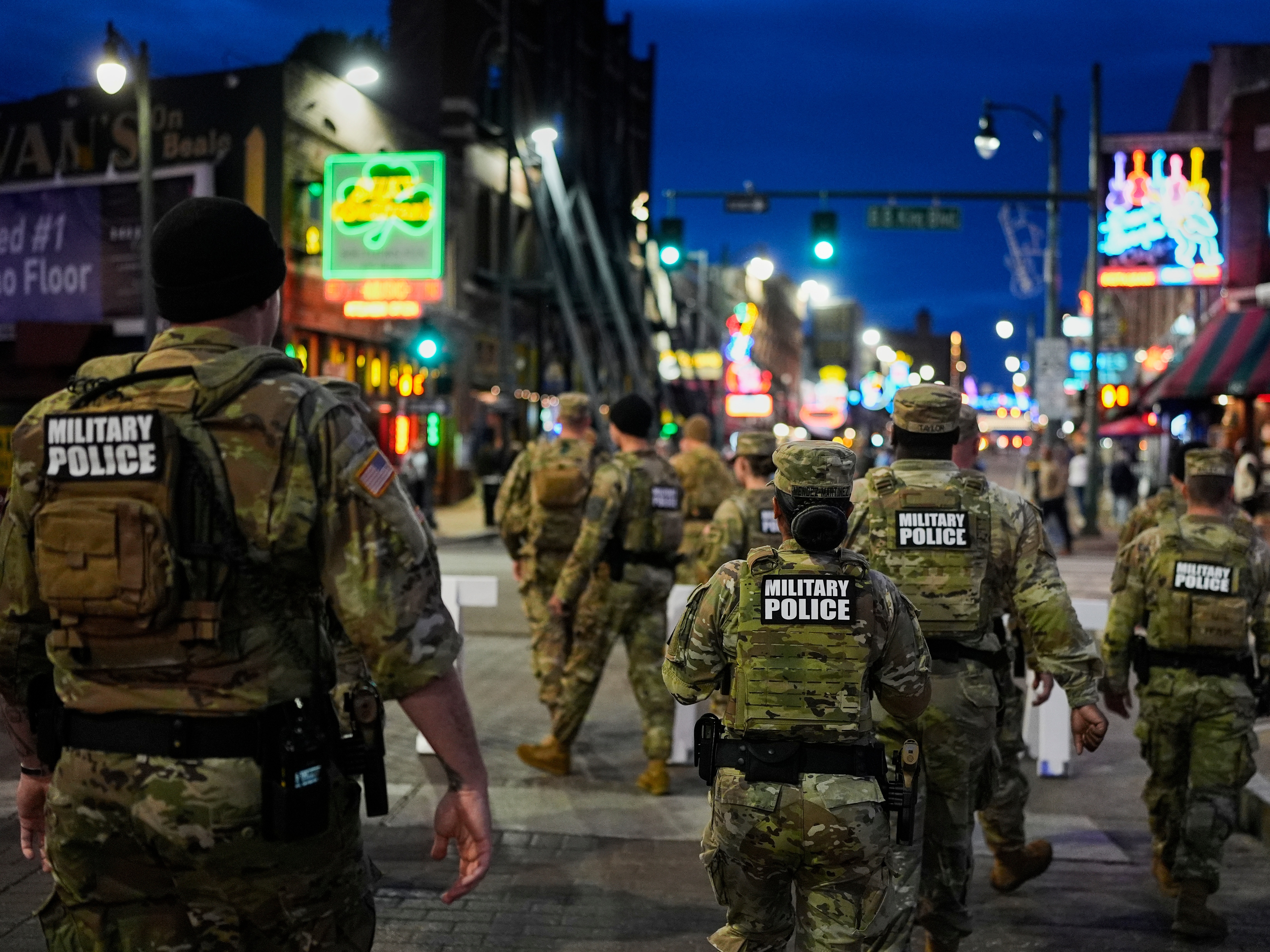 caption: Members of the National Guard patrol along Beale Street, Oct. 24, in Memphis, Tenn. Missouri Gov. Mike Kehoe recently authorized members of his state National Guard to assist immigration agents with clerical and logistical tasks.