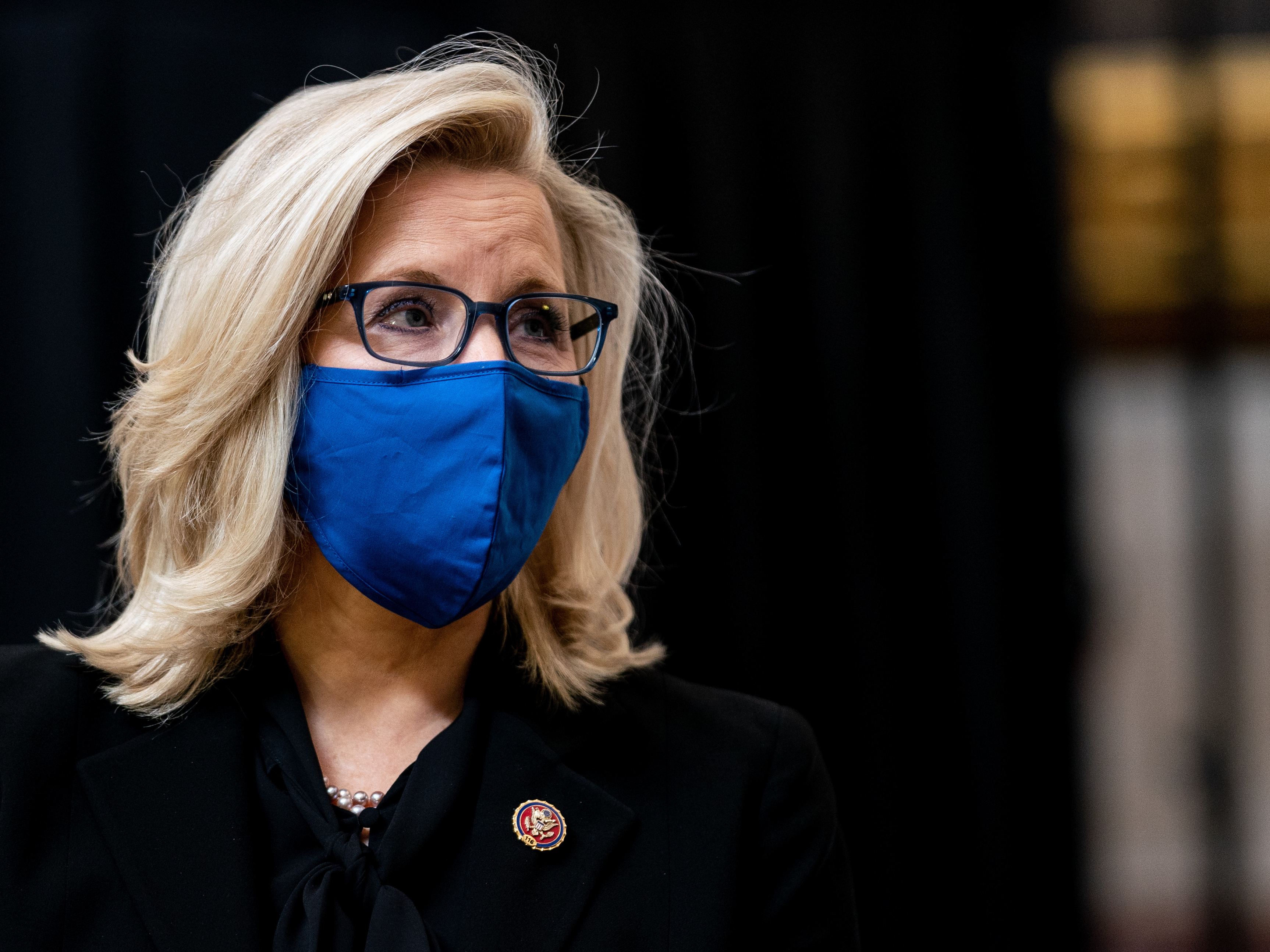 caption: U.S. Rep. Liz Cheney attends a congressional tribute to the late Capitol Police officer Brian Sicknick who lies in honor in the Rotunda of the U.S. Capitol on February 3, 2021.
