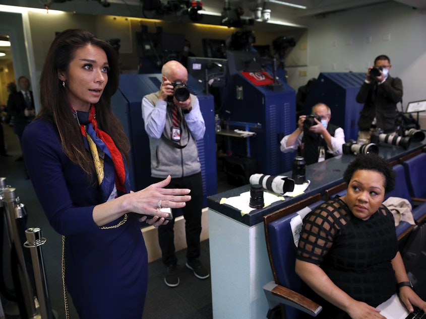 caption: One America News White House Correspondent Chanel Rion asks a question of President Donald Trump during a briefing about the coronavirus in April 2020. DirecTV isn't renewing the network's contract.