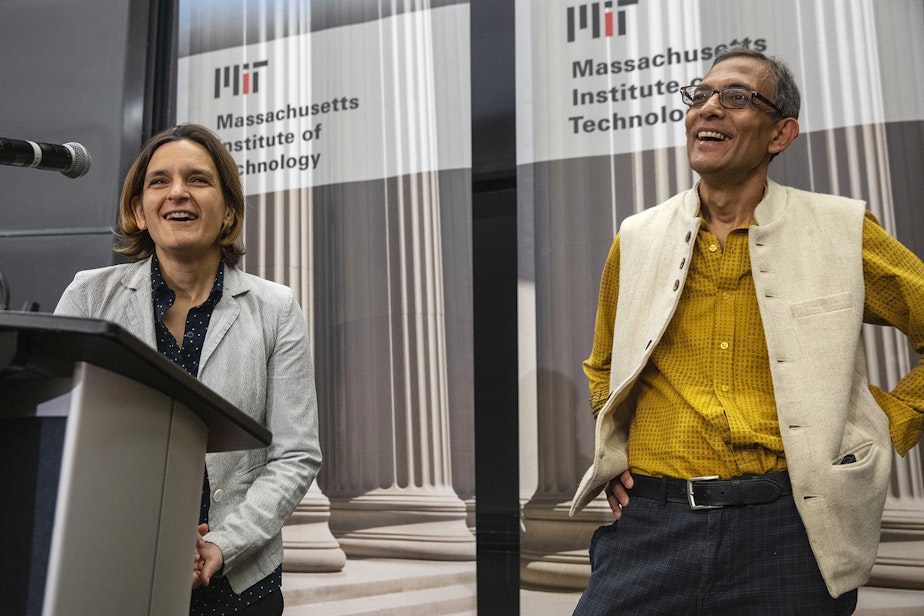 caption: Esther Duflo, left, and Abhijit Banerjee speak during a news conference at Massachusetts Institute of Technology in Cambridge, Mass., Monday, Oct. 14, 2019. Banerjee and Duflo, along with Harvard's Michael Kremer, were awarded the 2019 Nobel Prize in economics for pioneering new ways to alleviate global poverty. (Michael Dwyer/AP)