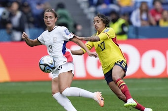 caption: South Korea's Casey Phair, left, and Colombia's Carolina Arias compete for the ball during the Women's World Cup Group H soccer match between Colombia and South Korea at the Sydney Football Stadium in Sydney, Australia, Tuesday, July 25, 2023.