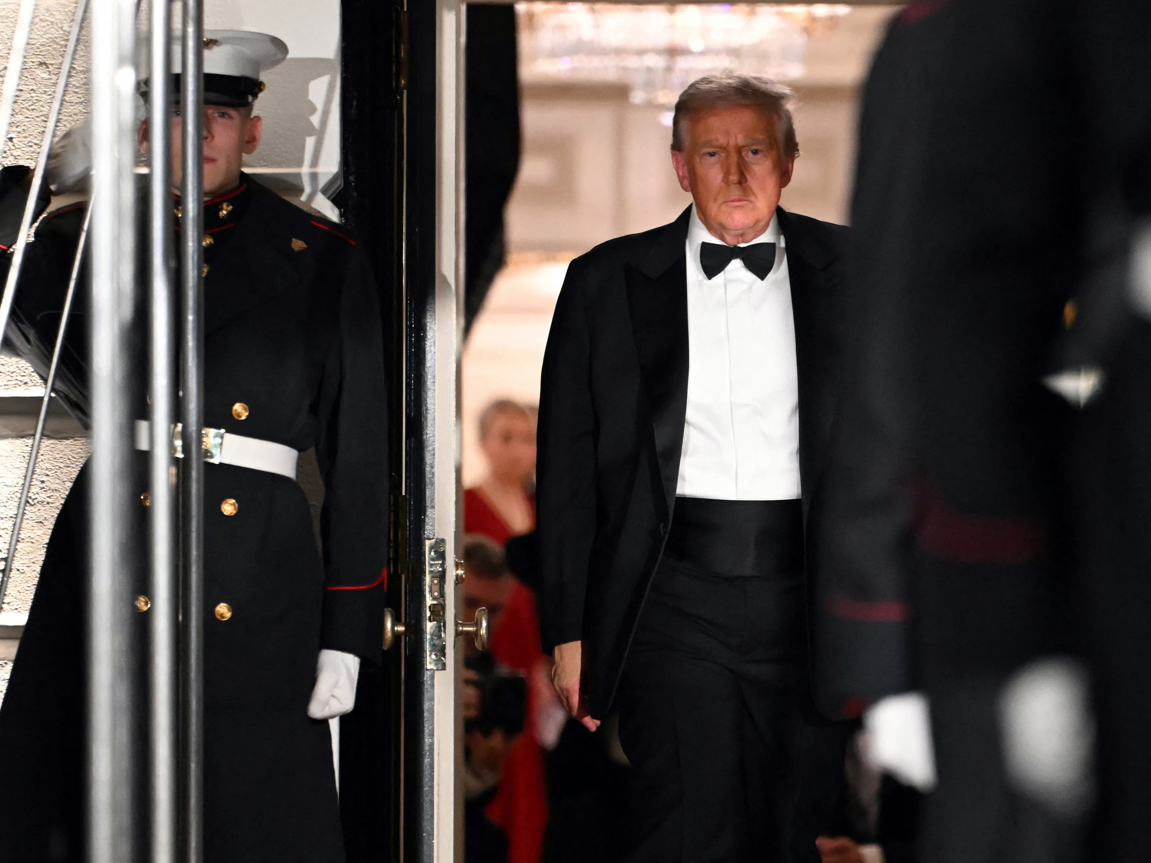 caption: President Trump steps out to welcome the Crown Prince of Saudi Arabia Mohammed bin Salman prior to a state dinner at the White House on Tuesday.