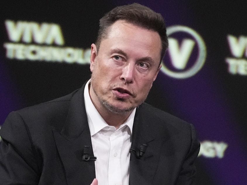 caption: Elon Musk, who owns X, formerly known as Twitter, is facing an advertiser backlash on the platform, which is reliant on advertising revenue.