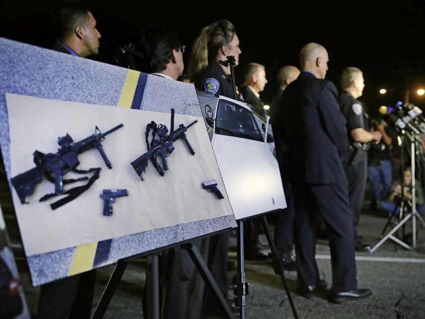 caption: Police crime photos of assault rifles and handguns are displayed during a news conference near the site of a mass shooting in San Bernardino, Calif., on Dec. 3, 2015.