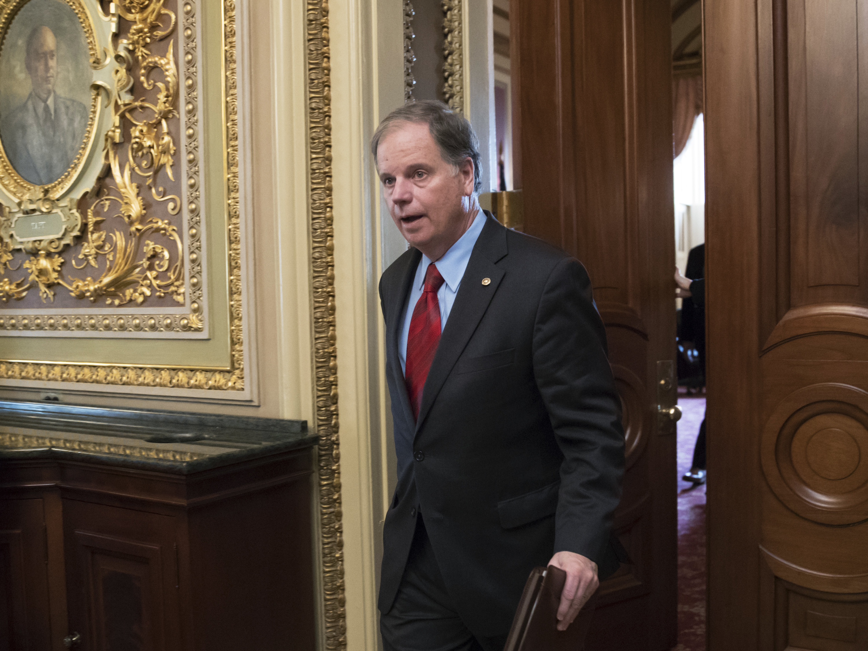 caption: Former Sen. Doug Jones of Alabama, seen here in a 2018 file photo, has been tapped to help President Biden's to-be-named Supreme Court nominee through the Senate confirmation process.