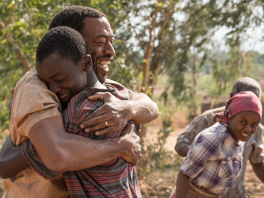 caption: <em></em>In <em>The Boy Who Harnessed the Wind</em>, Chiwetel Ejiofor (left) plays Trywell, the father of titular teenager William Kamkwamba (played by Maxwell Simba). Ejiofor also directed the movie and wrote the screenplay.