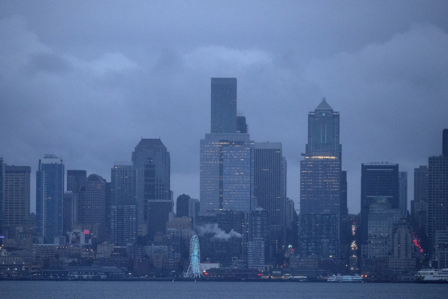 caption: The sun sets on Thursday, November 3, 2022, seen from Harbor Avenue Southwest in Seattle.
