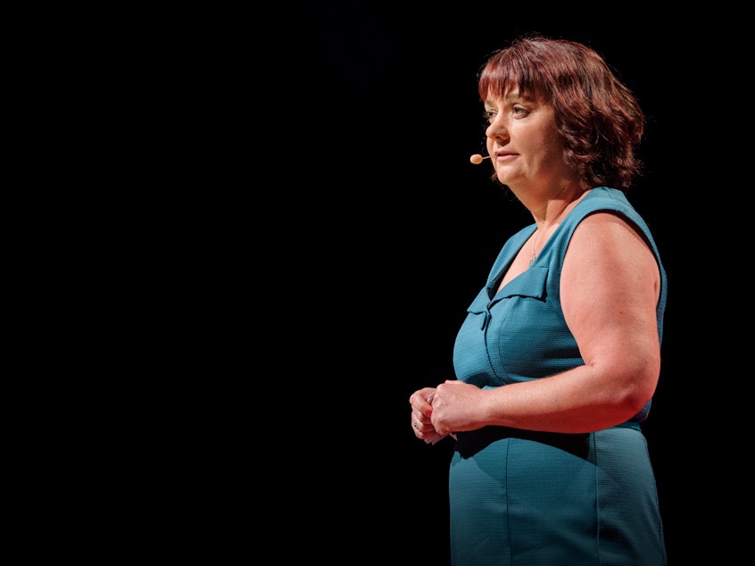 caption: Michelle Knox on the TED stage.