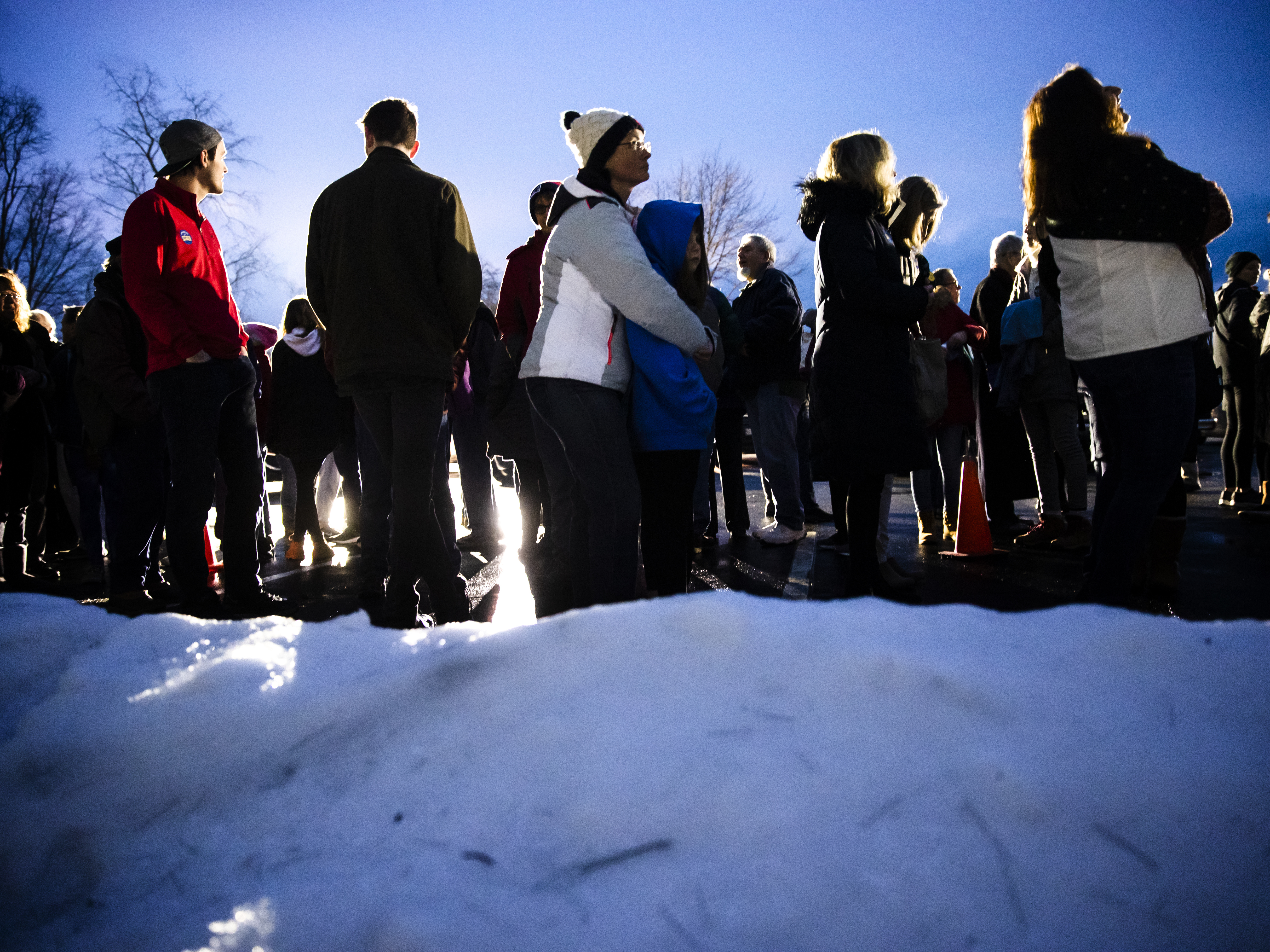 caption: People wait in line to enter an event for Democratic presidential candidate former South Bend, Ind., Mayor Pete Buttigieg Monday.