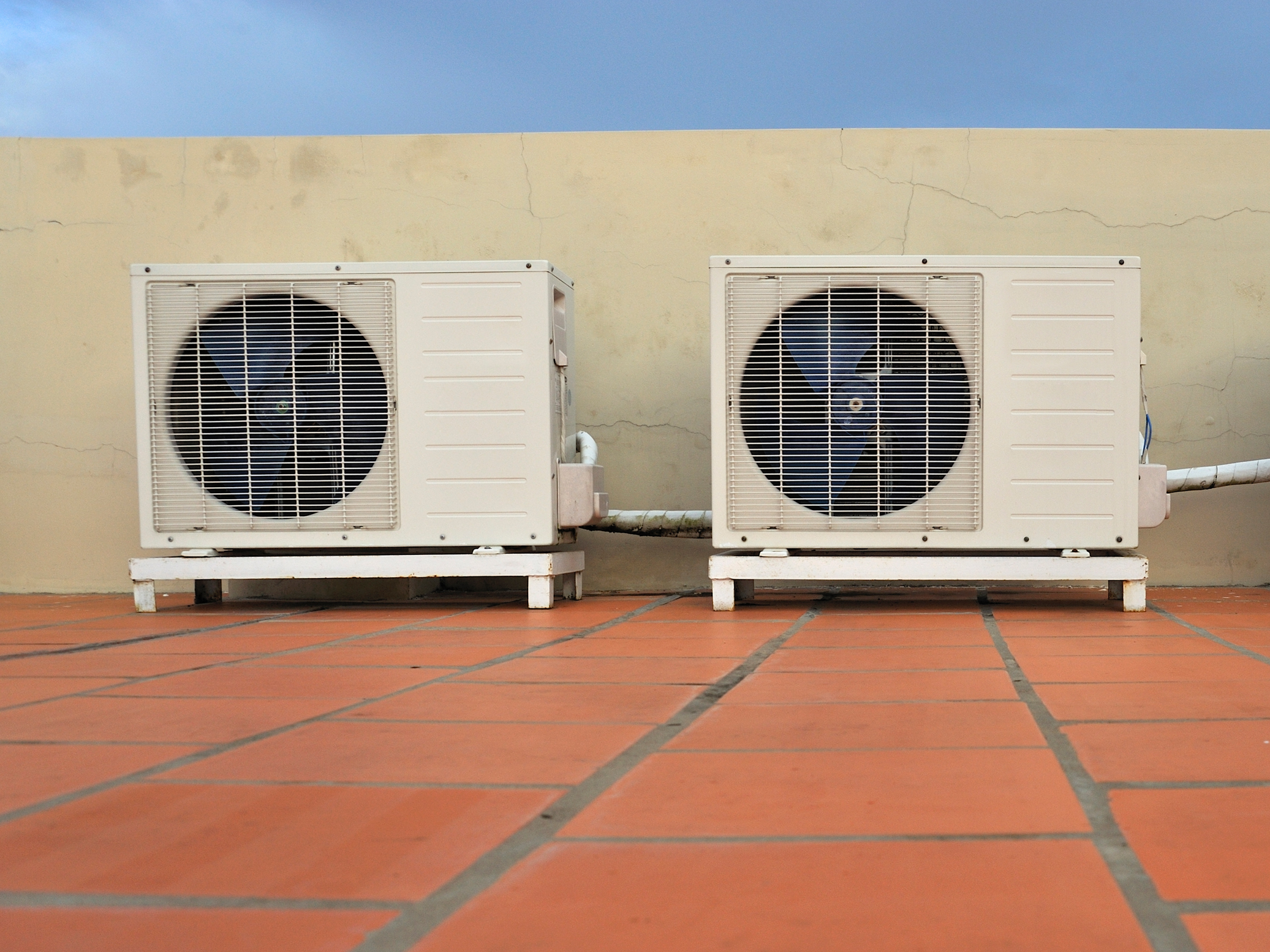 caption: Air conditioners on a building. HVAC installers report hundreds of calls in the wake of record high temperatures June 28 in the Pacific Northwest.
