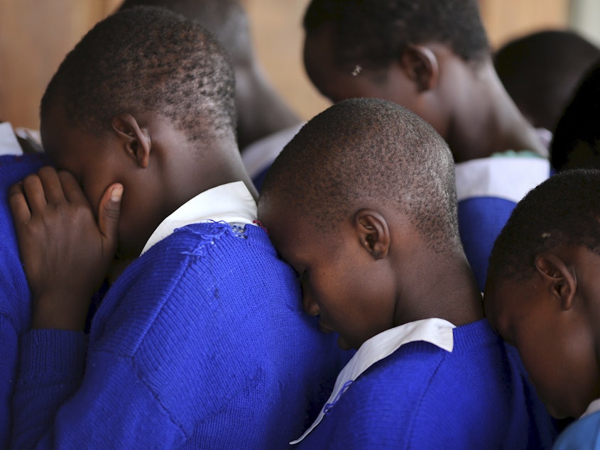 caption: Students rehearse a poem that they will recite at an event advocating against female genital mutilation at the Imbirikani Girls High School in Imbirikani, Kenya.