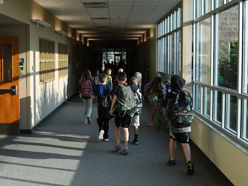 caption: Students head to class in Thornton, Colo., this month. Infectious disease experts say the decline in vaccination rates against childhood diseases during the pandemic has increased the potential for outbreaks of diseases that were once largely vanquished in the U.S.