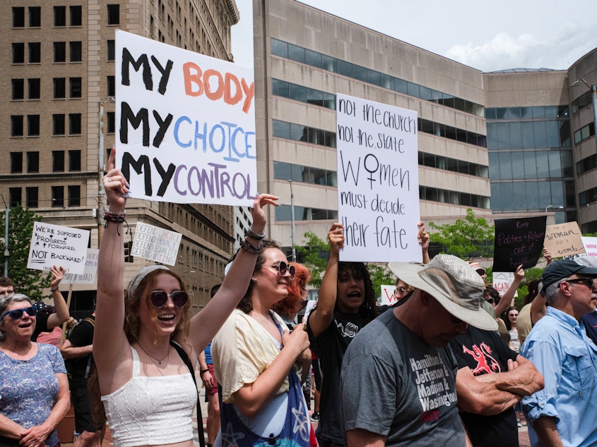 caption: In May, demonstrators gathered in Dayton, Ohio, to protest in favor of abortion rights after the leak of the draft of a U.S. Supreme Court decision that would overturn <em>Roe v. Wade</em>. A raped 10-year-old Ohio girl's abortion in Indianapolis recently became national news.