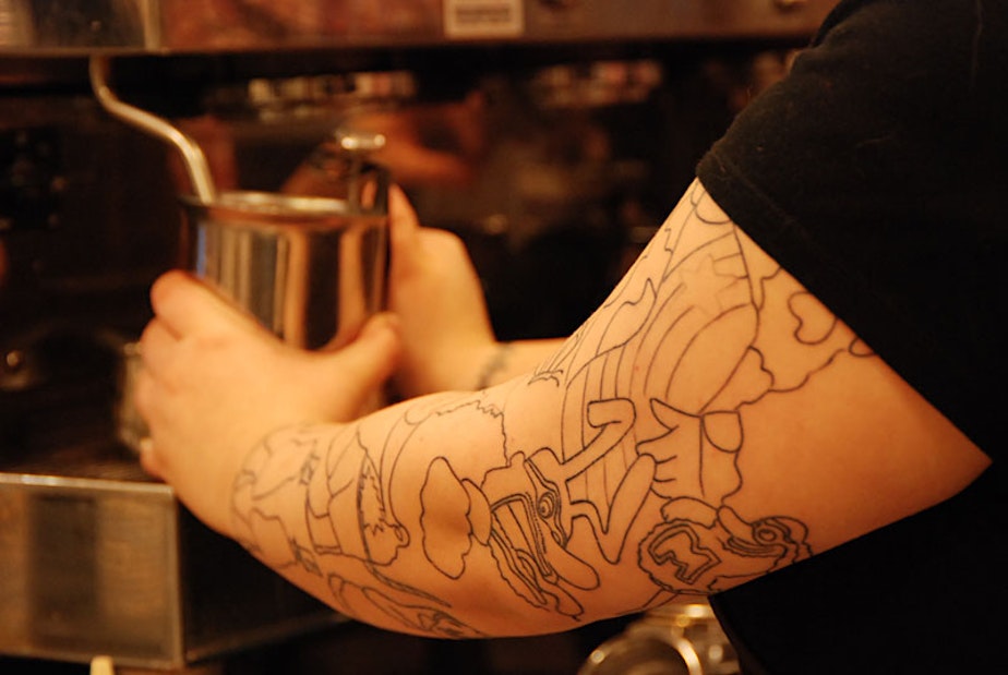 caption: Starbucks announced this week the company would review its "no visible tat" policy for baristas.