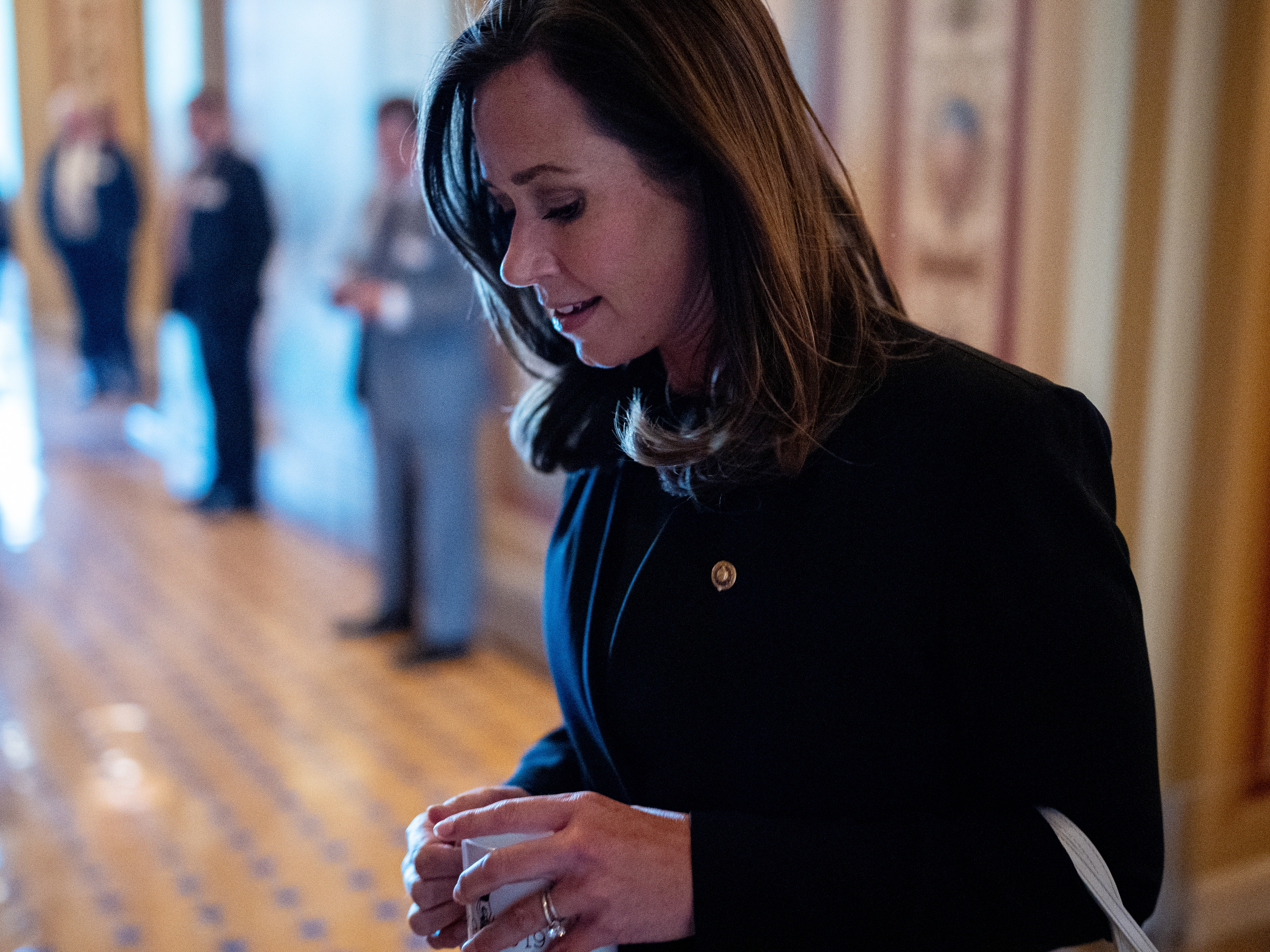 caption: Sen. Katie Britt, R-Ala., arrives for a meeting on Capitol Hill on June 18, 2024. Britt has taken on a leading role helping negotiate changes to immigration enforcement.