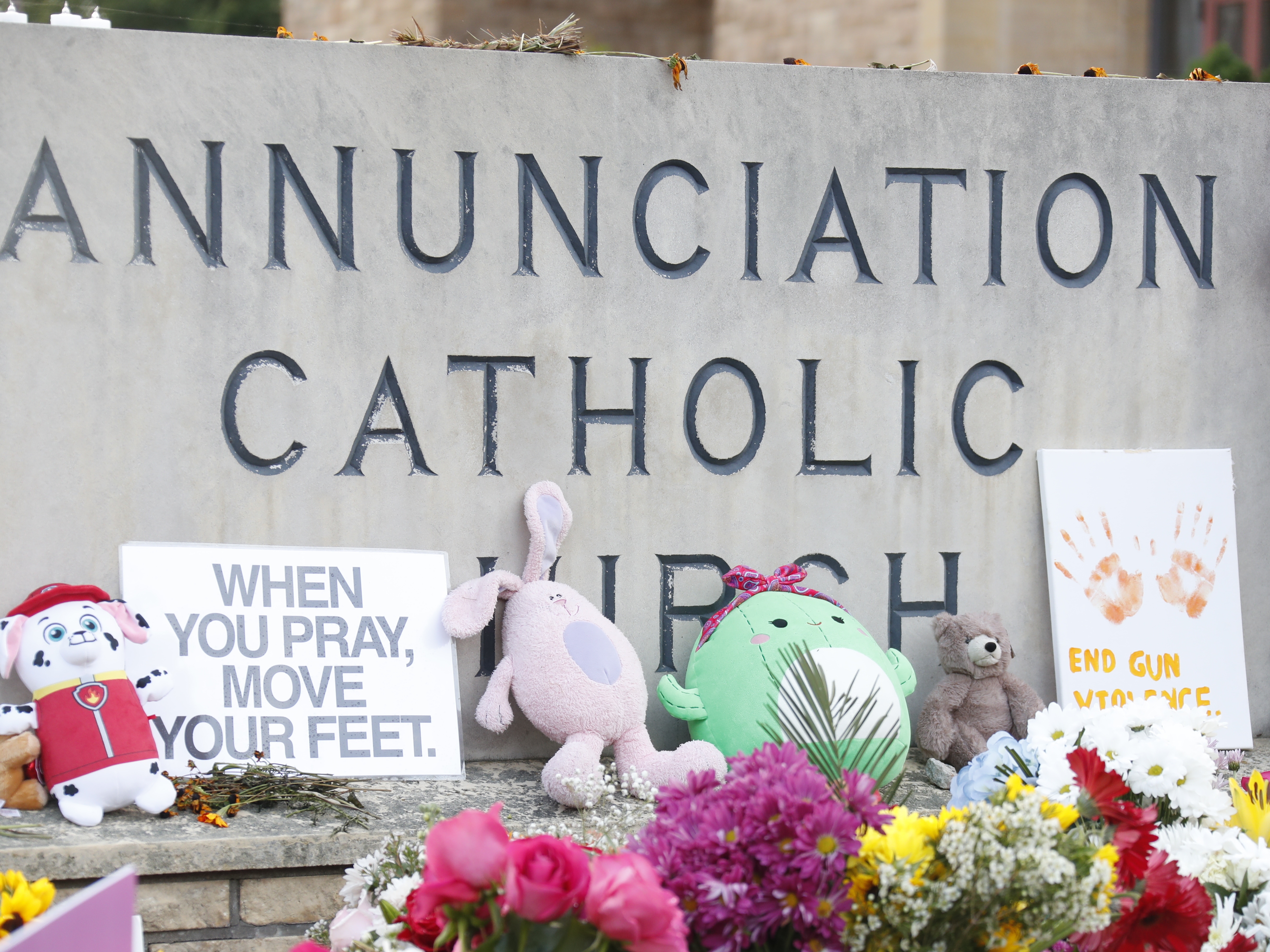 caption: A make-shift memorial is set up at Annunciation Catholic Church after the Wednesday's shooting at the school, Friday, Aug. 29, 2025, in Minneapolis.