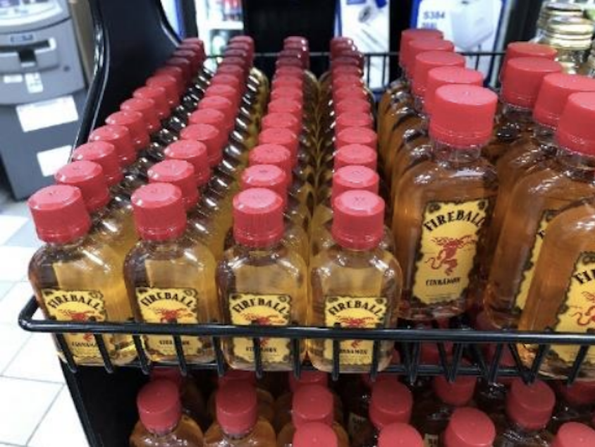 caption: Smaller bottles of Fireball do not contain whiskey, but a blend of malt beverage, wine and additional flavors and colors. Customers are suing the company for fraud, alleging the packaging is misleading.