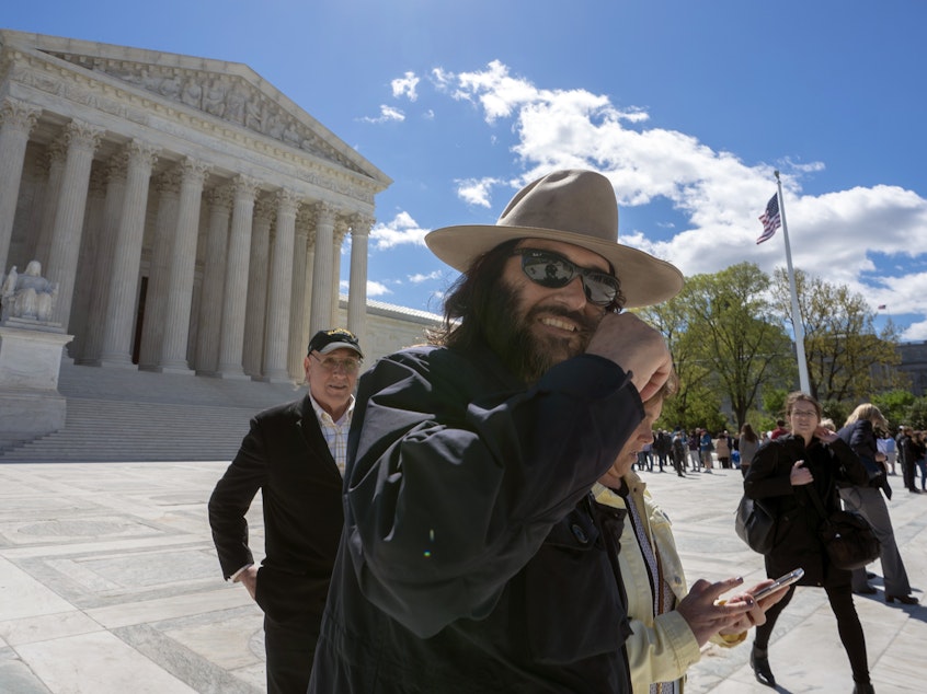 caption: Los Angeles artist Erik Brunetti, the founder of the streetwear clothing company FUCT, leaves the Supreme Court after his trademark case was argued on April 15.