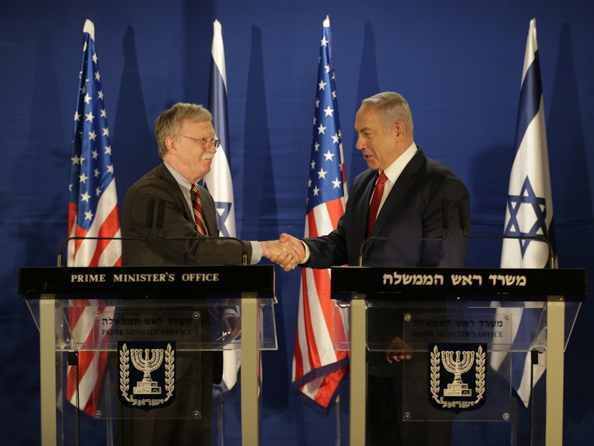 caption: U.S. National Security Advisor John Bolton (left) and Israeli Prime Minister Benjamin Netanyahu shake hands during a joint statement to the media follow their meeting, in Jerusalem on Sunday.