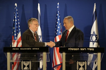 caption: U.S. National Security Advisor John Bolton (left) and Israeli Prime Minister Benjamin Netanyahu shake hands during a joint statement to the media follow their meeting, in Jerusalem on Sunday.