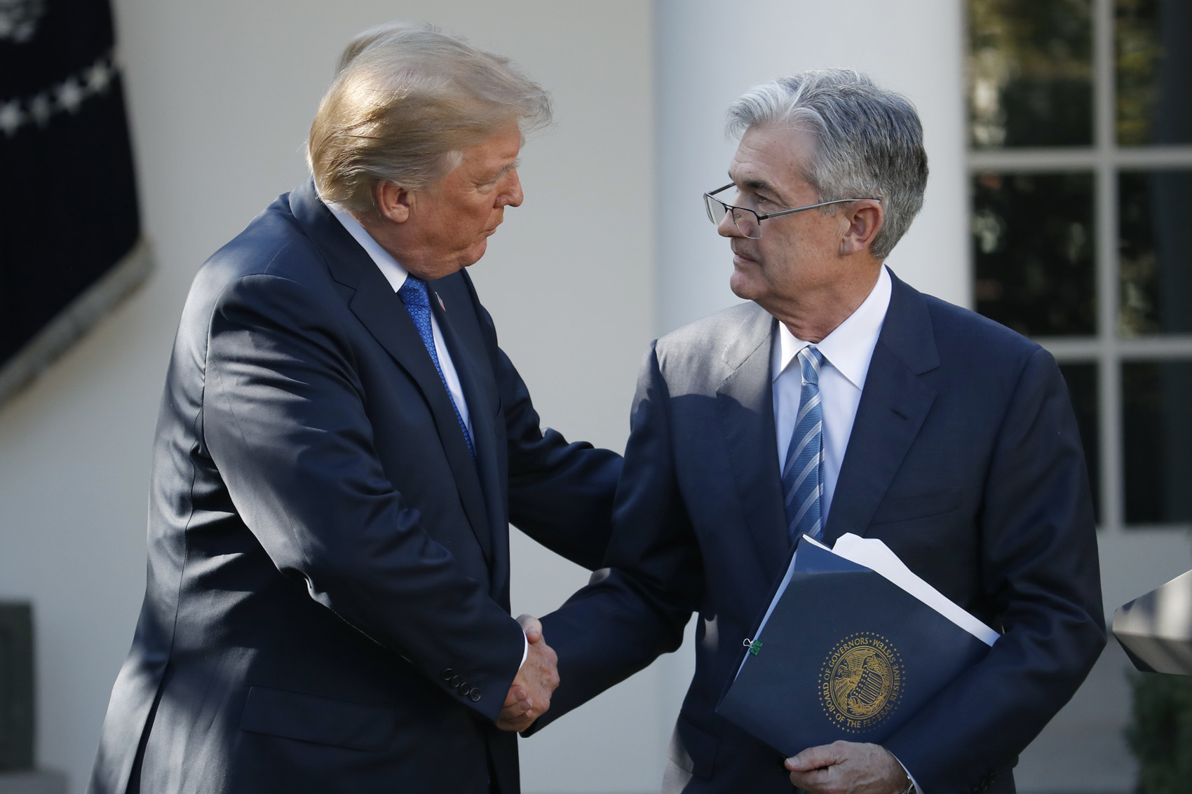 caption: President Donald Trump shakes hands with then-Federal Reserve board member Jerome Powell after announcing him as his nominee for the next chair of the Federal Reserve, in the Rose Garden of the White House in Washington, Nov. 2, 2017. (Alex Brandon, File/AP)