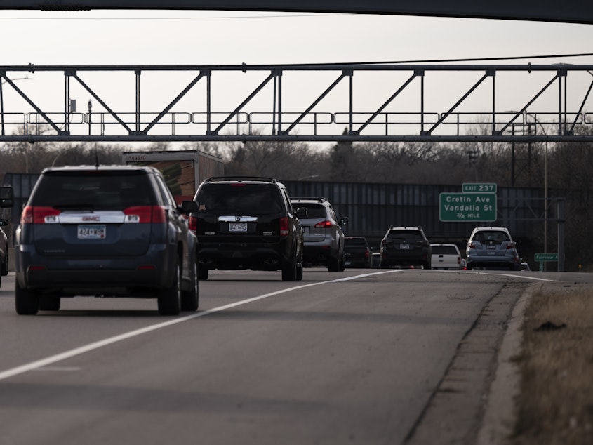 caption: Vehicles drive on highway I-94 in St. Paul, Minn., on Nov. 7, 2020. A recent report from the International Energy Agency said emissions fell across most parts of the economy, with one notable exception: SUVs.