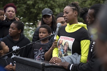 caption: Tiffany Rogers, a sister of Charleena Lyles, speaks during a vigil on Tuesday, June 19, 2017, at Solid Ground Brettler Family Place, in Seattle, Washington. 
