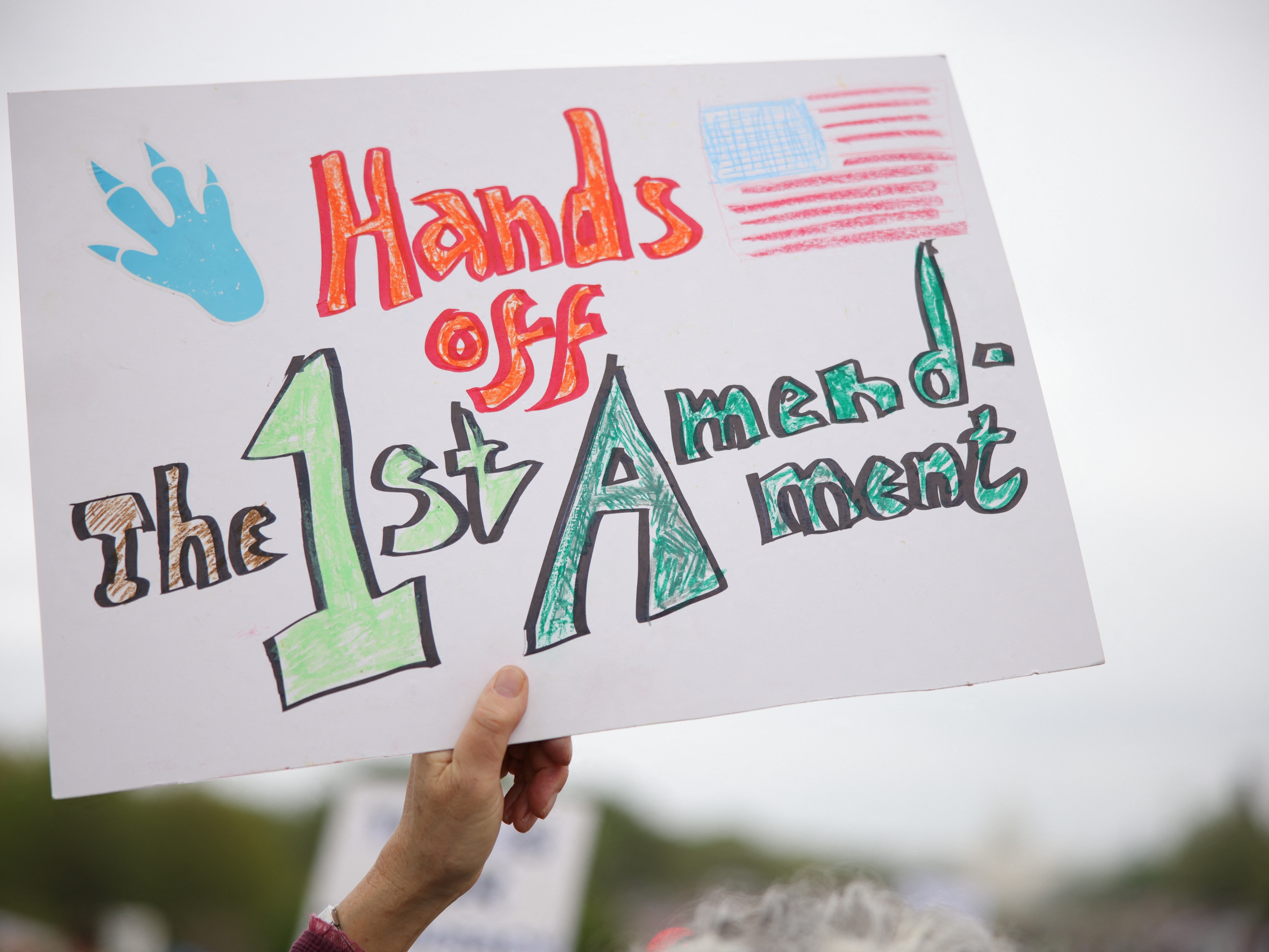 caption: People gathered to protest the Trump administration during the 'Hands Off' protest on the National Mall in Washington, D.C. on April 5, 2025.