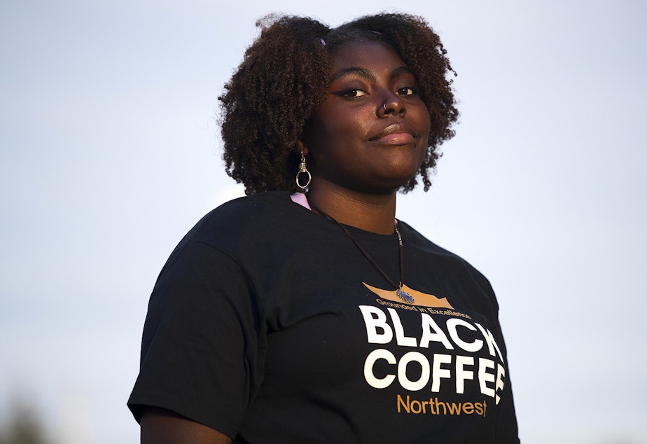 caption: President of Black Coffee Northwest, Mikayla Weary stands for a portrait on Thursday, October 15, 2020, along Aurora Avenue North in Shoreline.