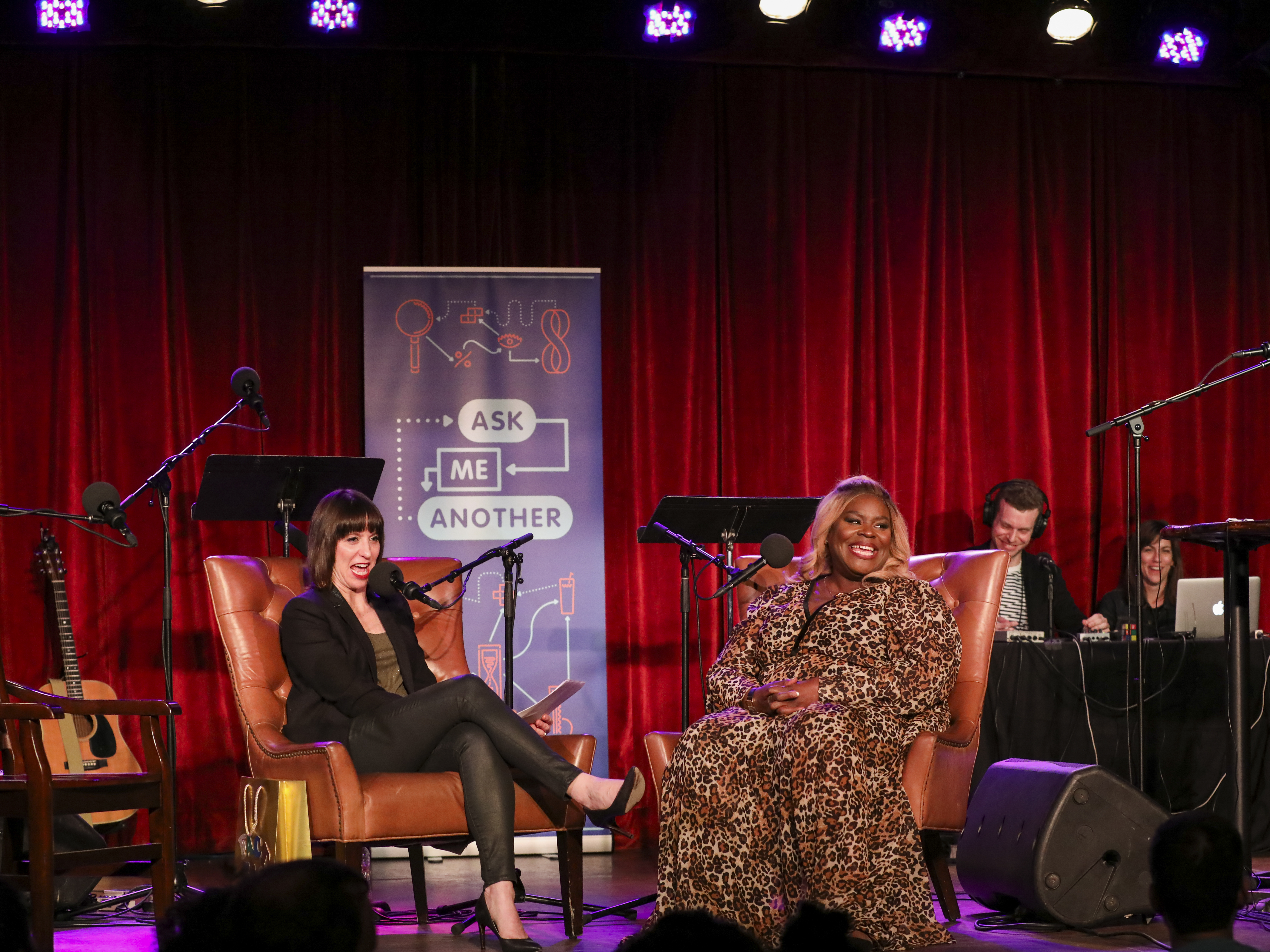 caption: Host Ophira Eisenberg and Retta on Ask Me Another at the Bell House in Brooklyn, New York.