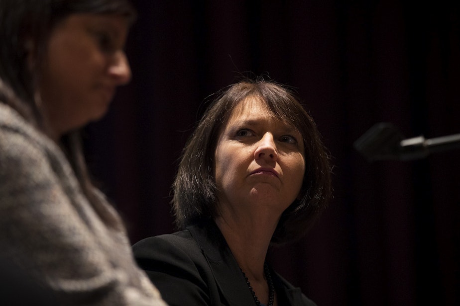 caption: Seattle Public School Superintendent Denise Juneau sits with Chief Human Resources Officer Clover Codd on stage during a public meeting on Thursday, February 13, 2020 at Garfield High School in Seattle.