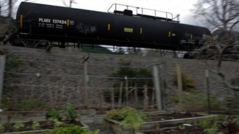caption: Unlike marine vessels, pipelines and terminal facilities, railroads are not required to file response plans for trains of tanker cars.