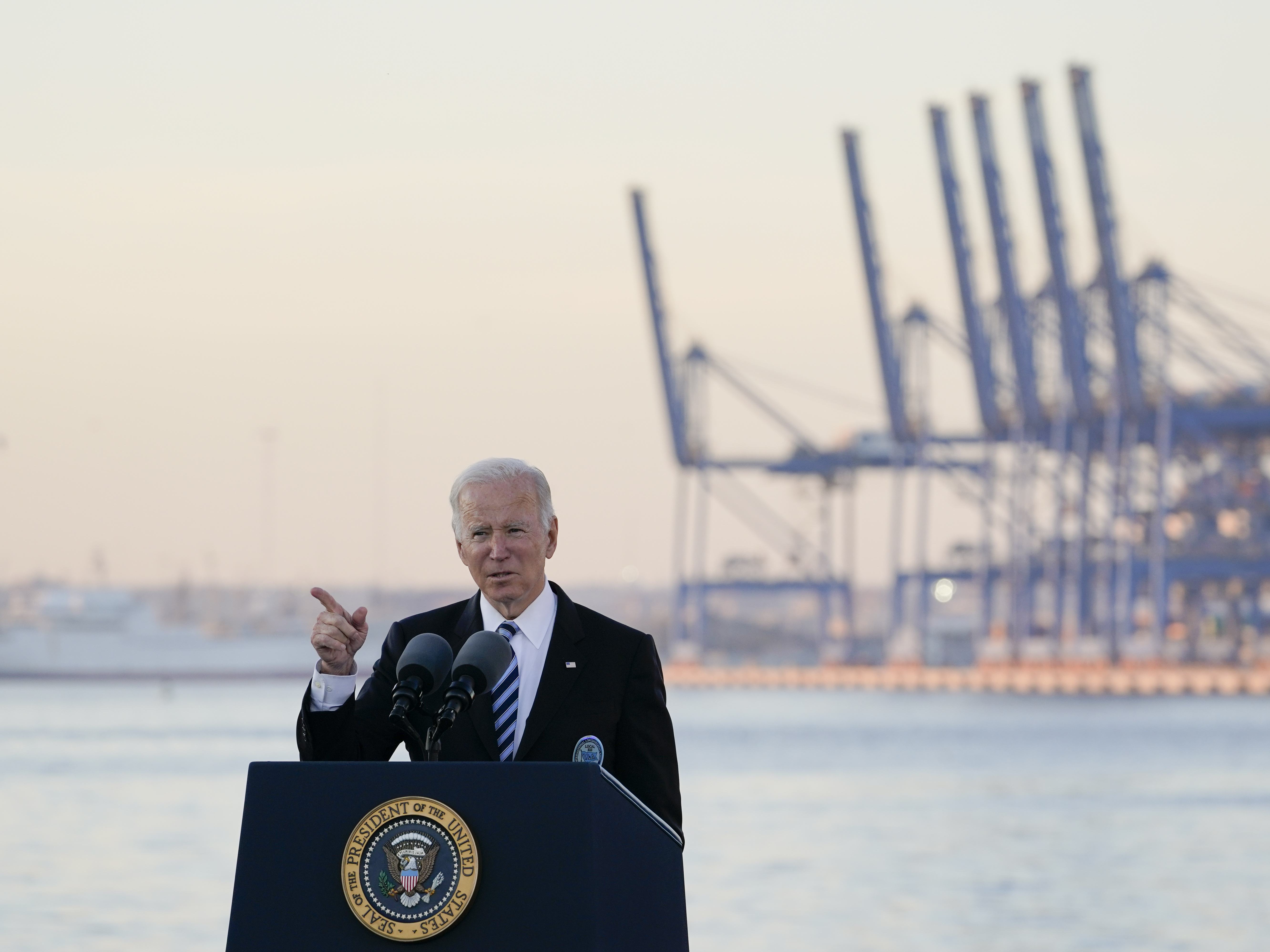caption: President Biden speaks during a visit to the Port of Baltimore on Nov. 10. He has said the United States needs to invest in infrastructure to help catch up to China.